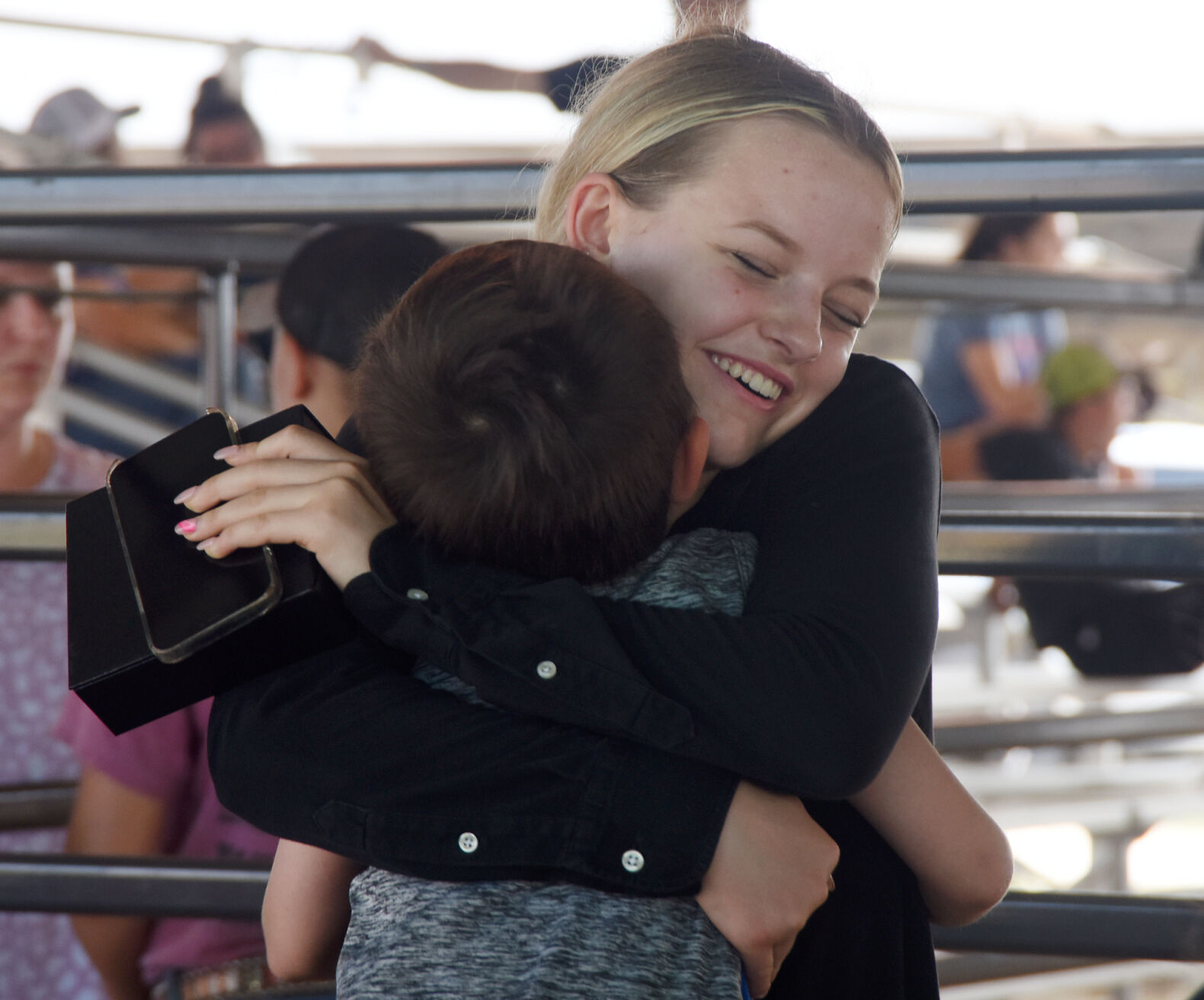 Ryan Rounsavall hugs her cousin